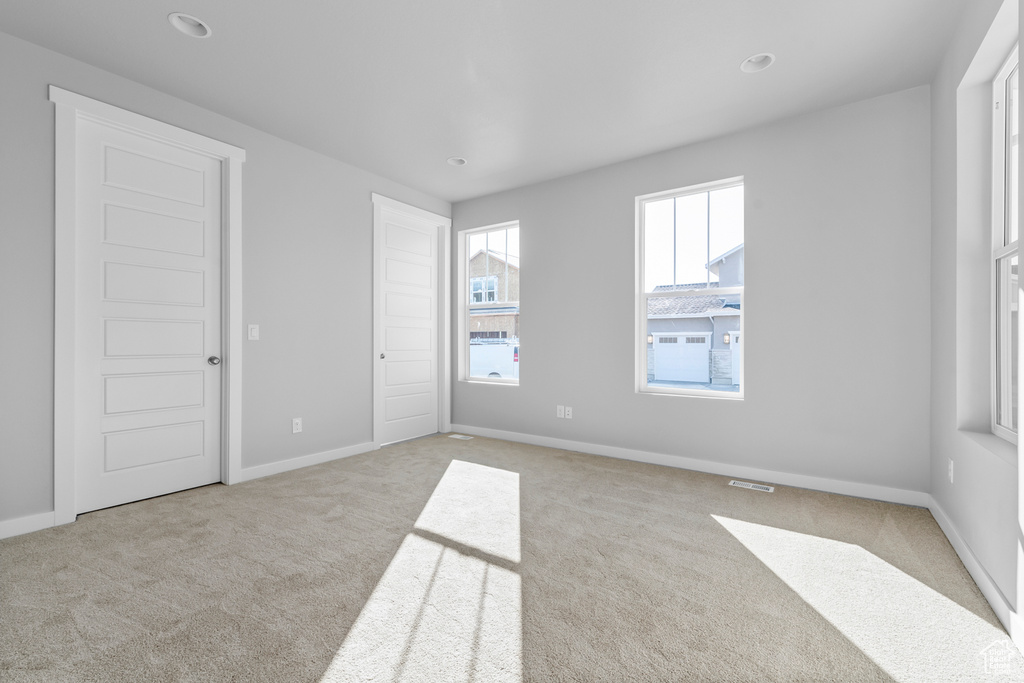 Unfurnished bedroom with carpet floors, recessed lighting, and baseboards
