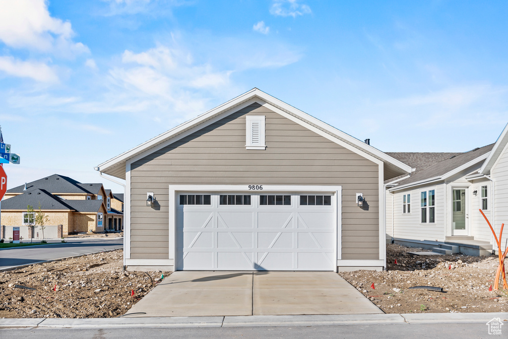 View of front of property with a garage