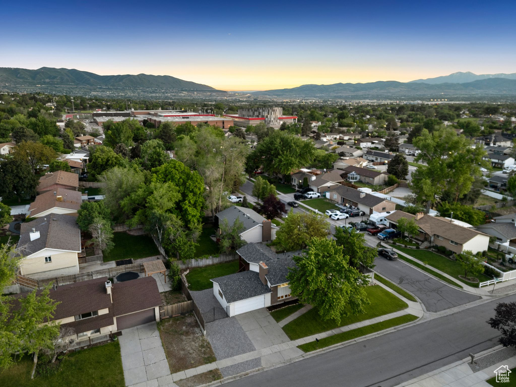 Aerial view of property\'s location with a mountainous background and nearby suburban area