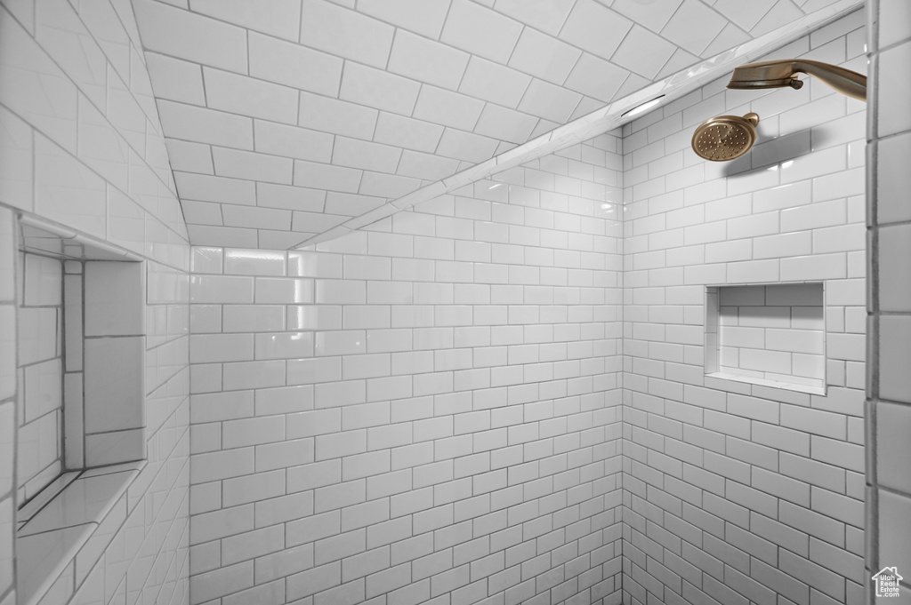 Full bath featuring tiled shower