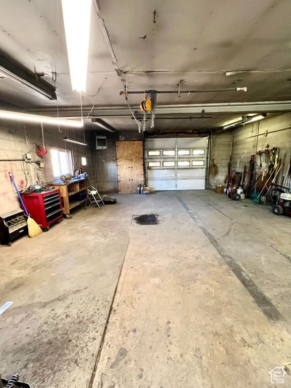 Garage featuring a workshop area