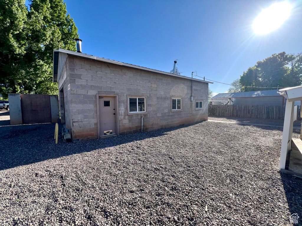 Back of property featuring concrete block siding