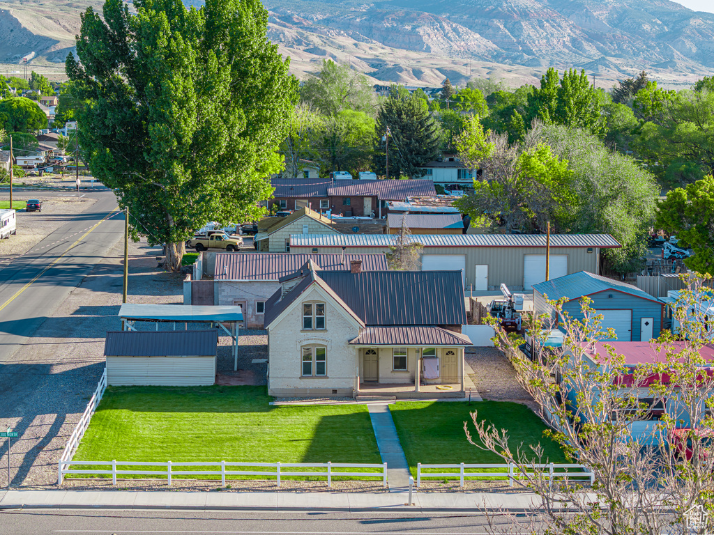 View of subject property featuring a mountainous background