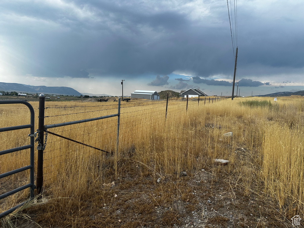 View of yard with a view of countryside and a mountain view