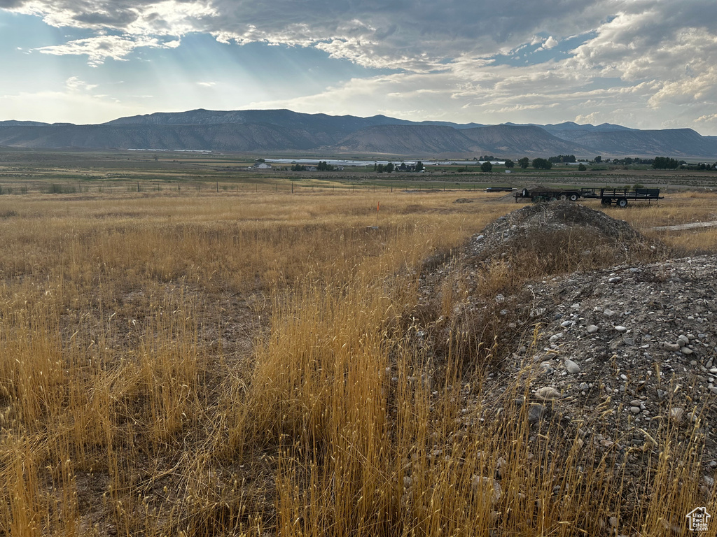 View of mountain backdrop featuring rural landscape