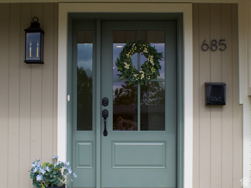 Entrance to property with board and batten siding