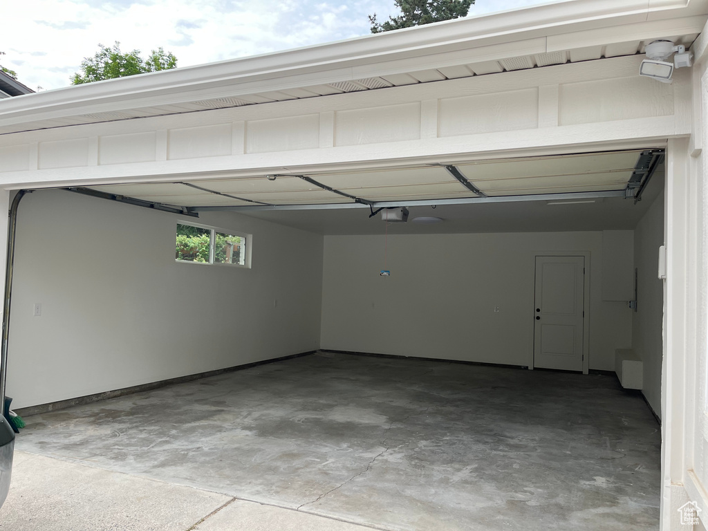 Garage featuring a garage door opener