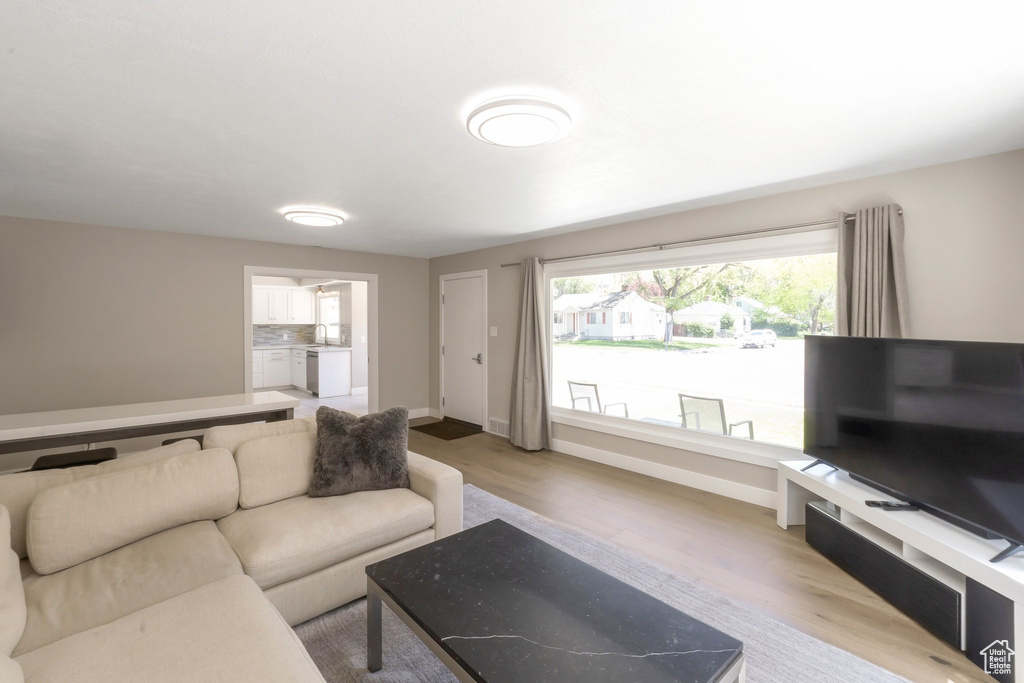 Living area featuring wood finished floors and baseboards