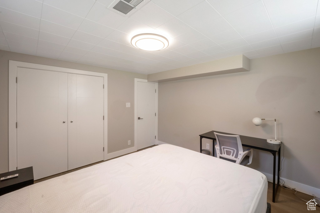Bedroom with a closet and baseboards