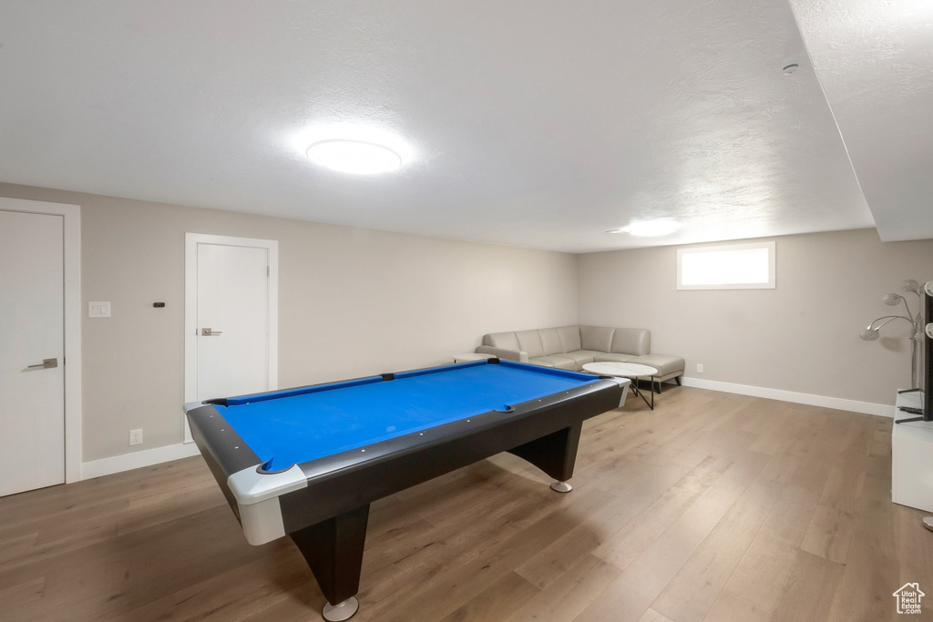 Rec room featuring billiards table, wood finished floors, and baseboards