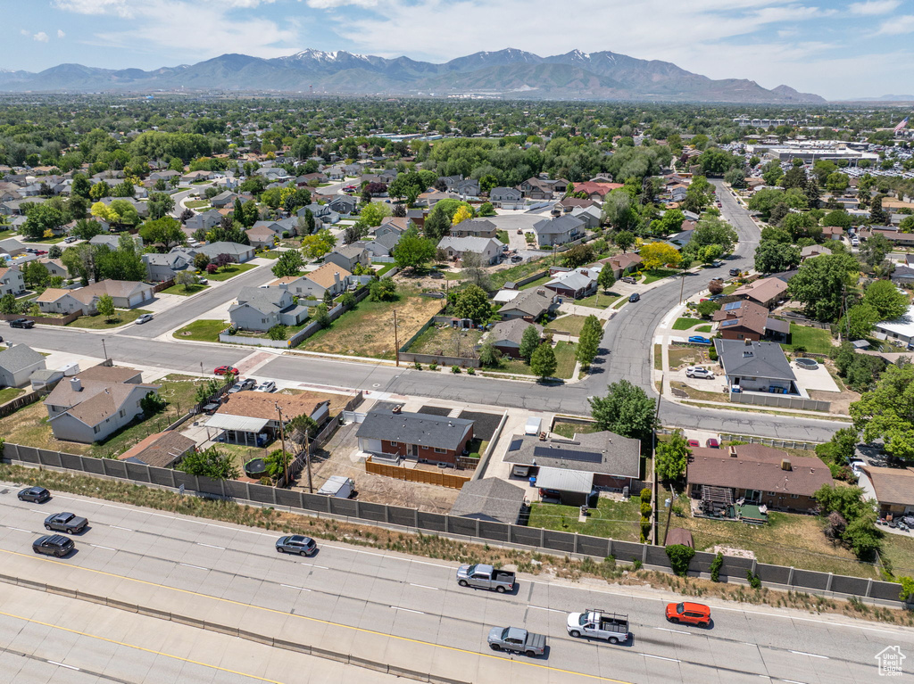Aerial perspective of suburban area with a mountainous background