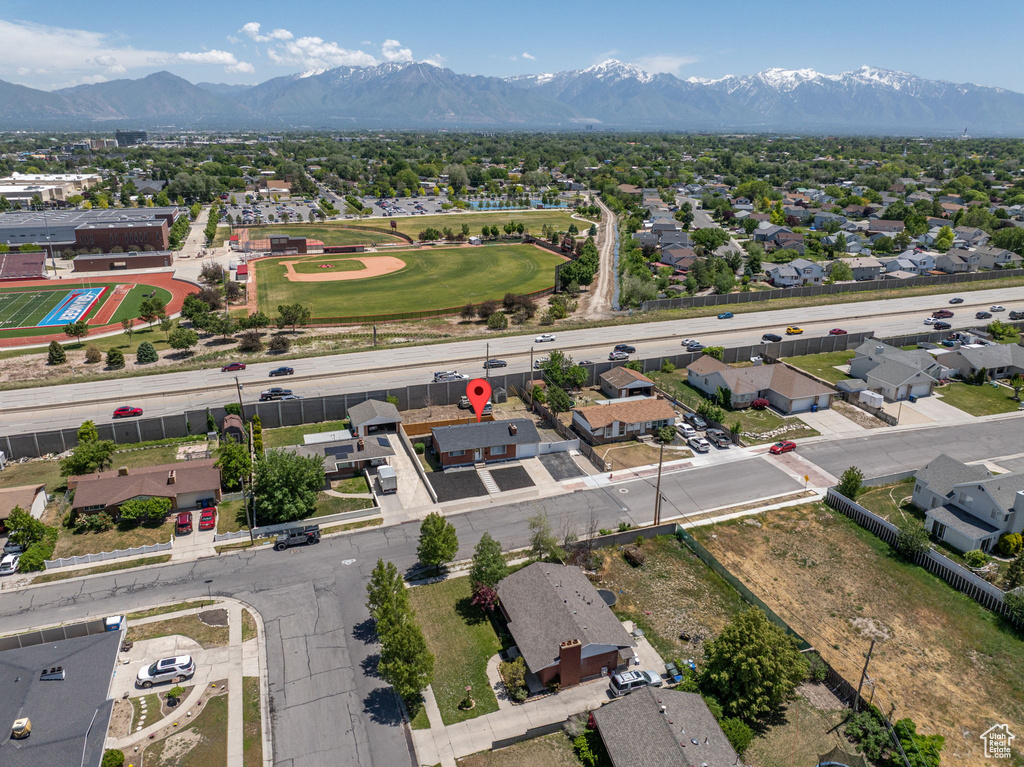 Aerial view of residential area featuring a mountain backdrop