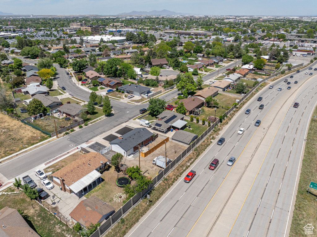 Aerial perspective of suburban area with a major roadway and mountains