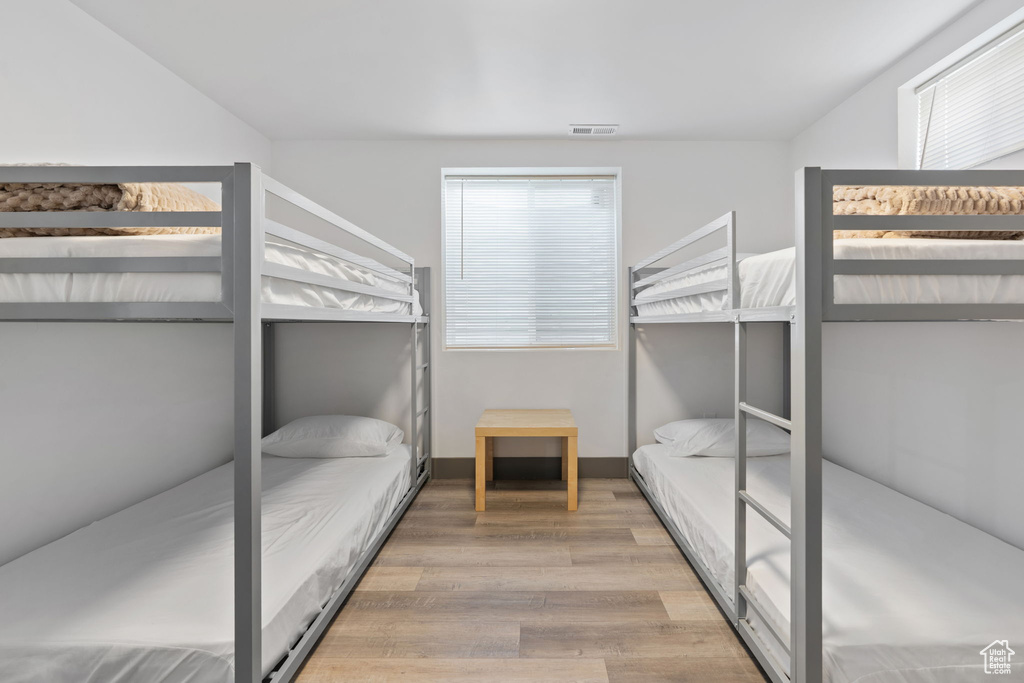 Bedroom with wood finished floors