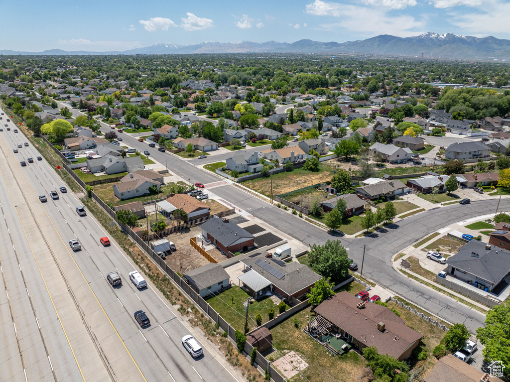 Aerial perspective of suburban area with a mountain backdrop