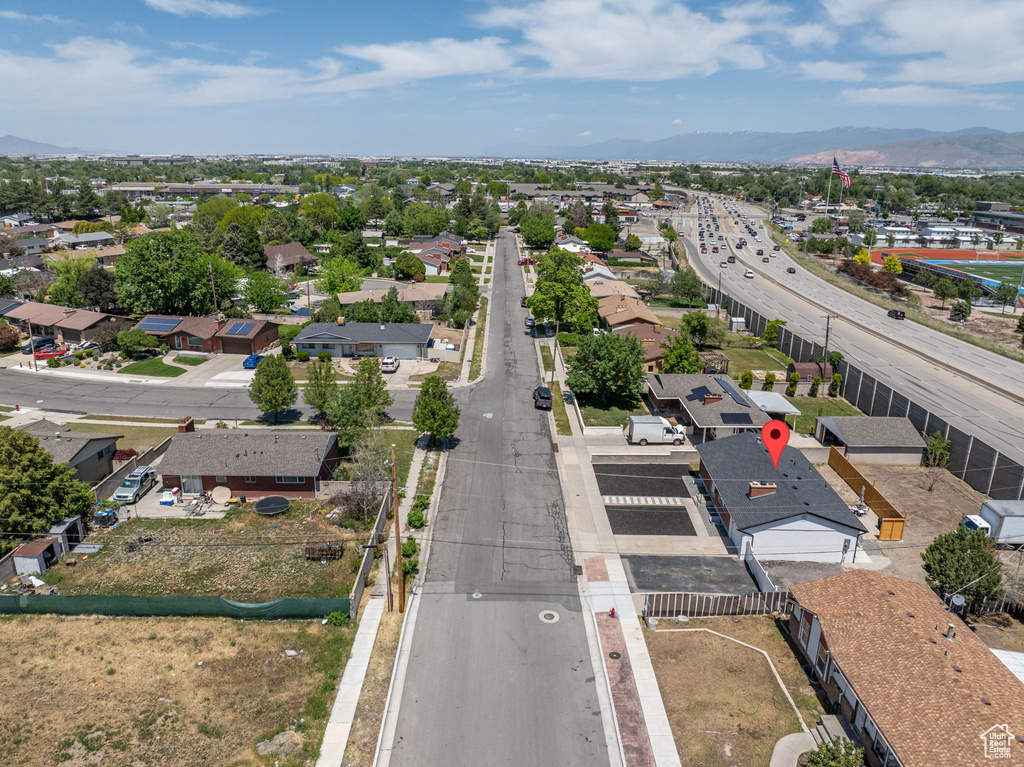 Aerial view of residential area featuring a mountain backdrop