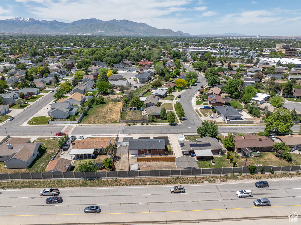 Aerial perspective of suburban area with a mountain backdrop