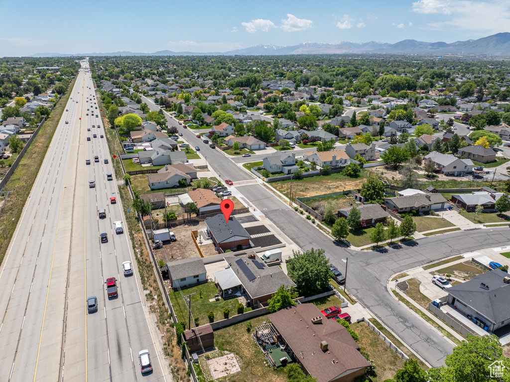 Aerial perspective of suburban area with a mountain backdrop