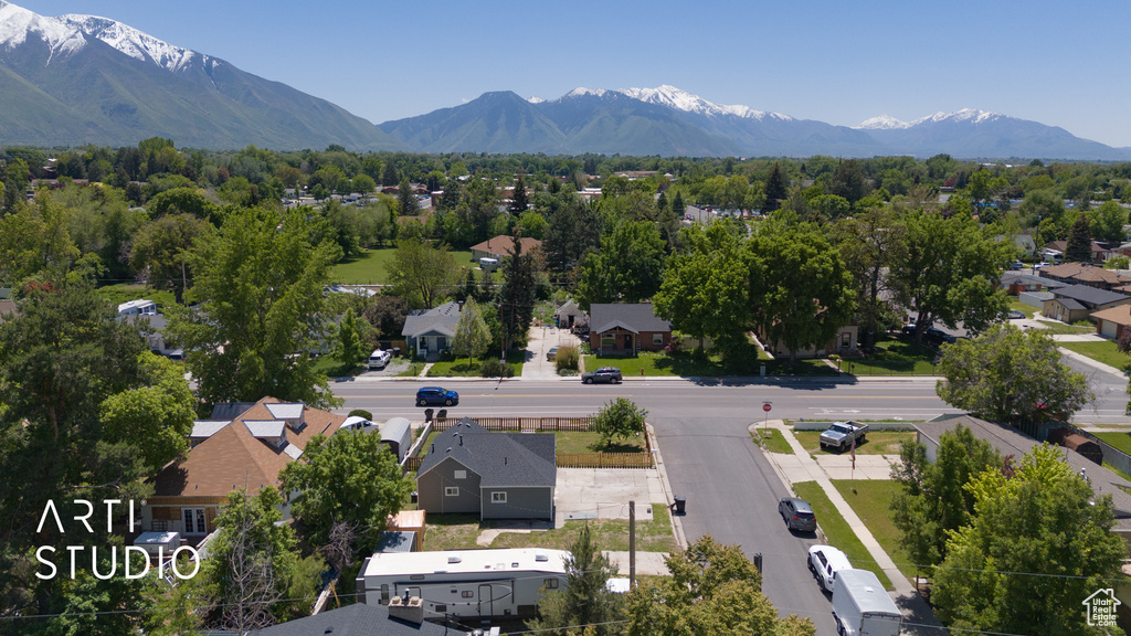 Aerial perspective of suburban area with a mountain backdrop