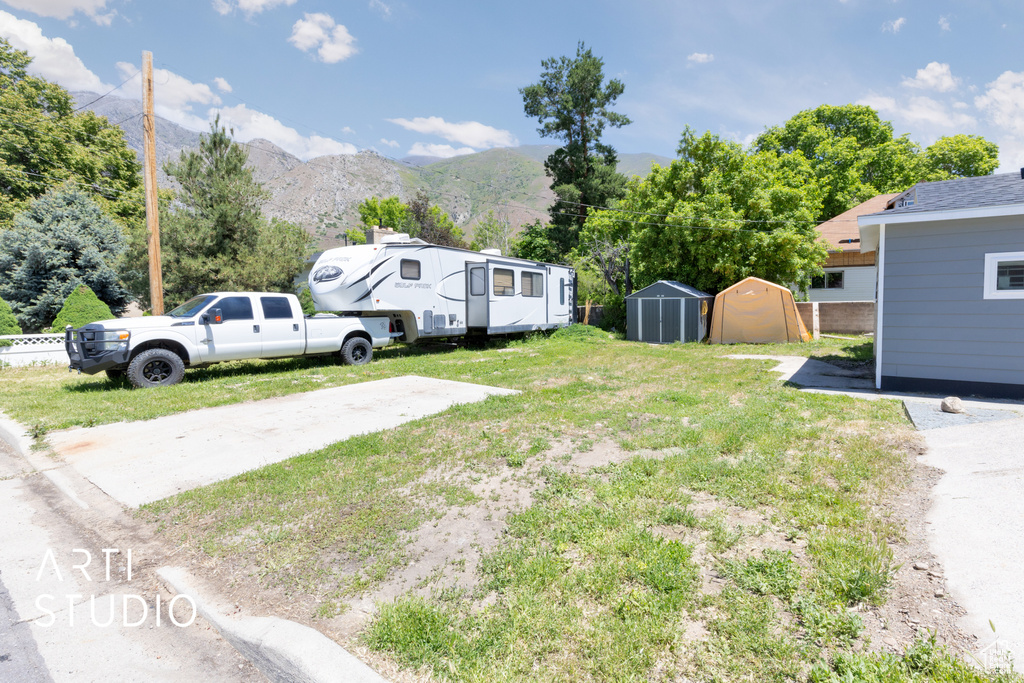 View of grassy yard featuring a mountain view