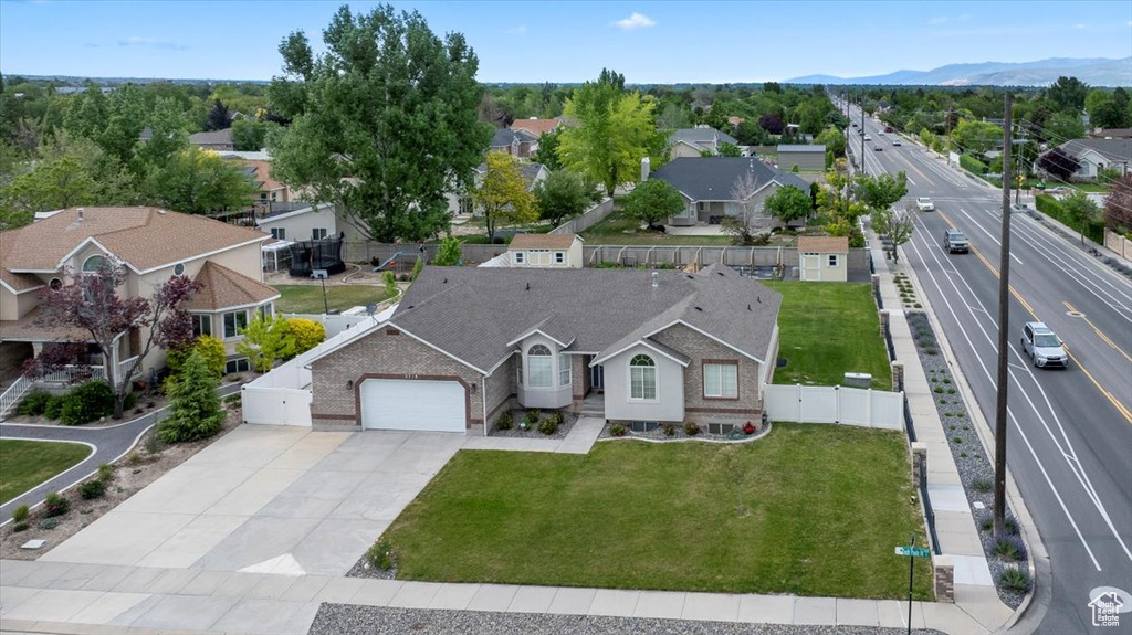 Aerial view of residential area featuring mountains