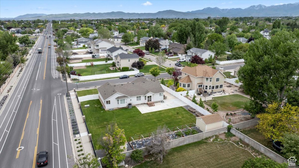 Aerial view of residential area featuring a mountainous background