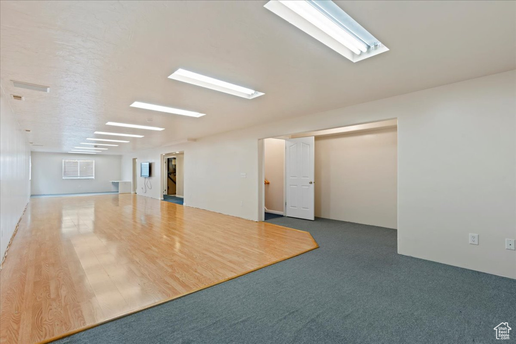 Spare room featuring a skylight