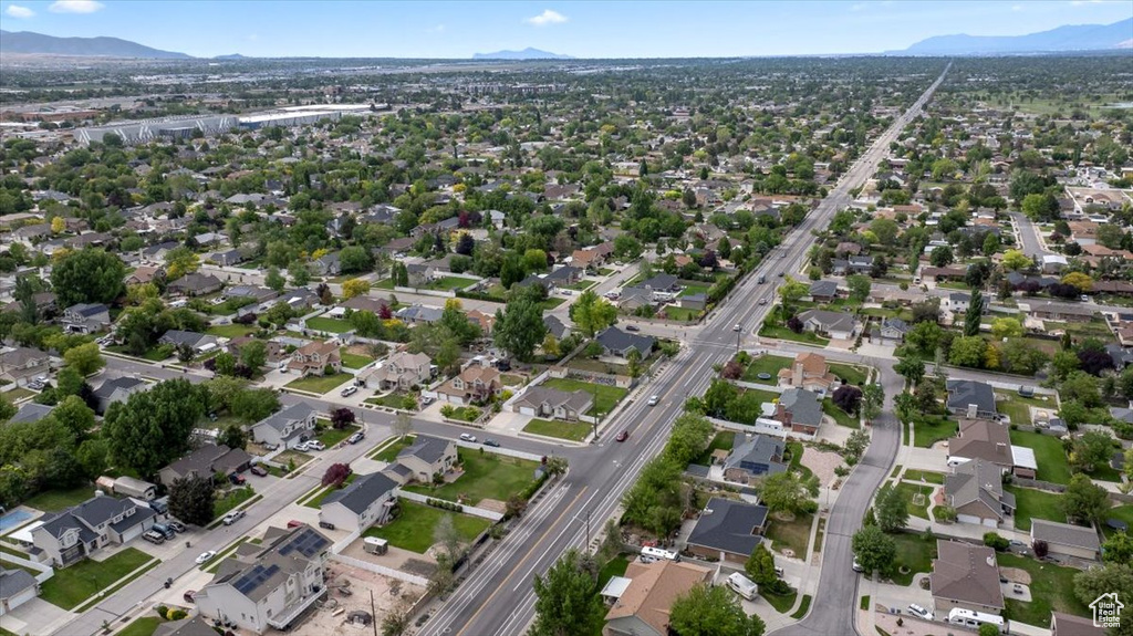 View of property location featuring mountains and nearby suburban area