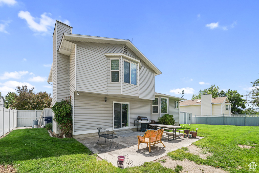Rear view of house featuring a patio area