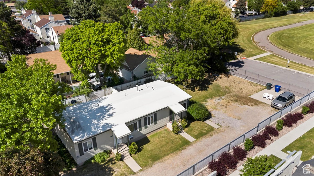 Aerial view of residential area featuring a tree filled landscape