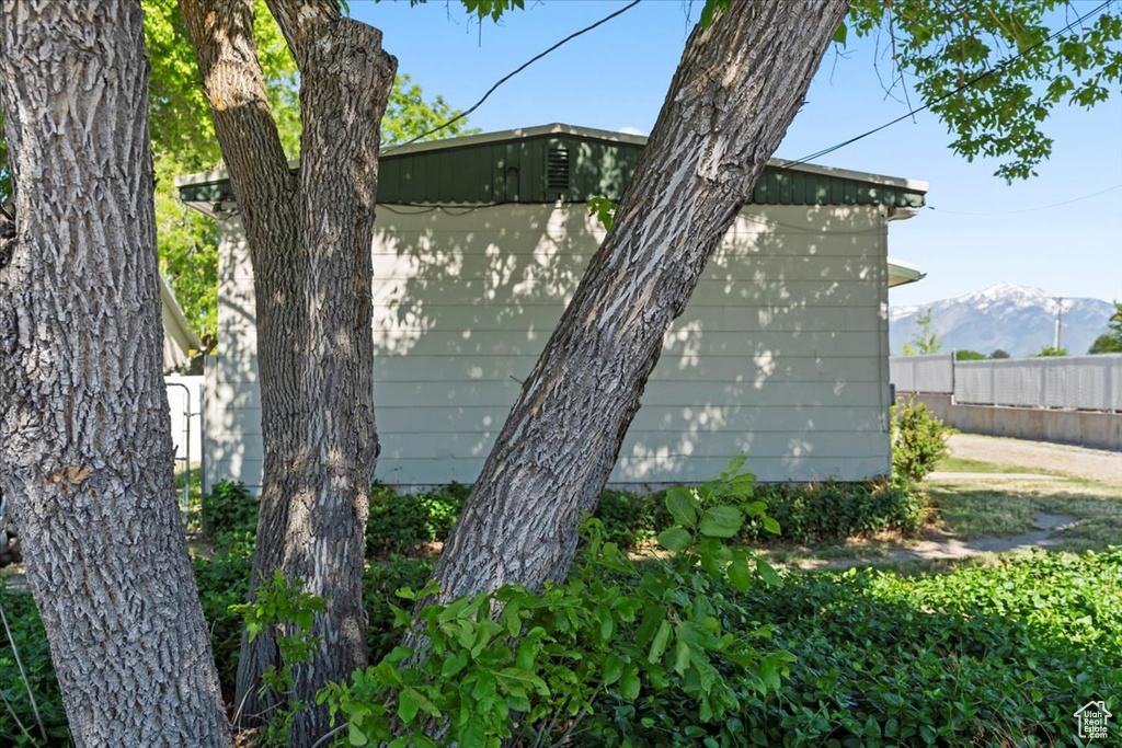 View of side of property with a mountain view