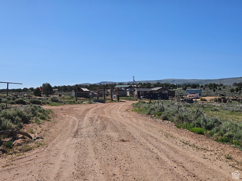 View of dirt / gravel road with a view of countryside