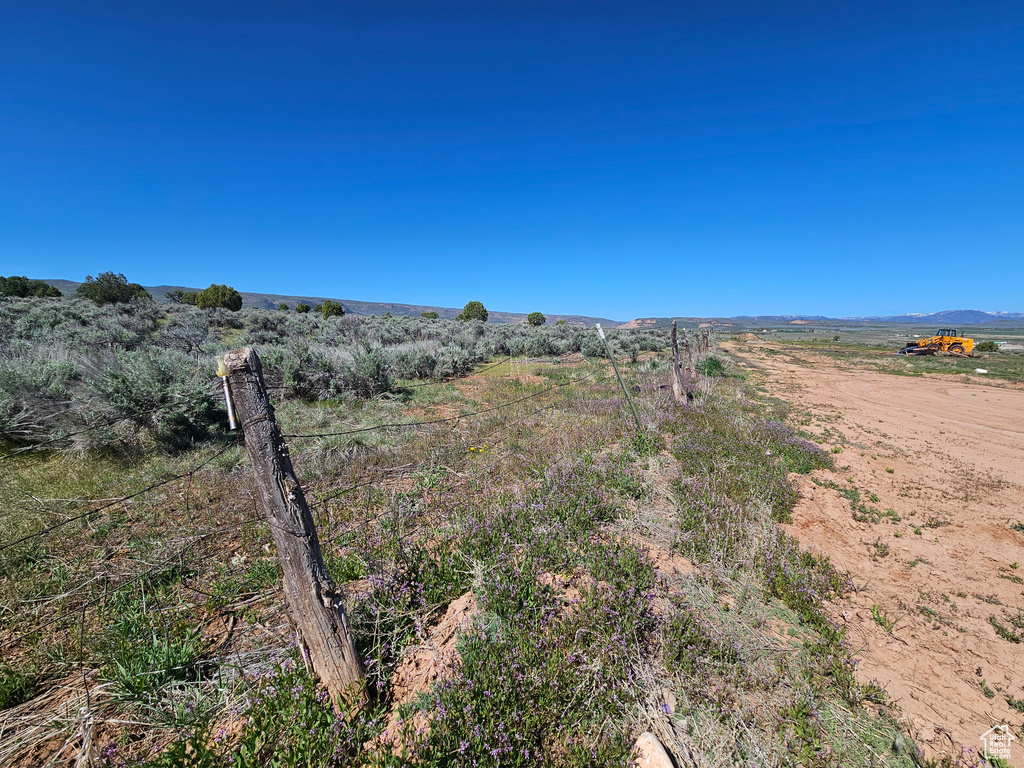 View of yard with a rural view