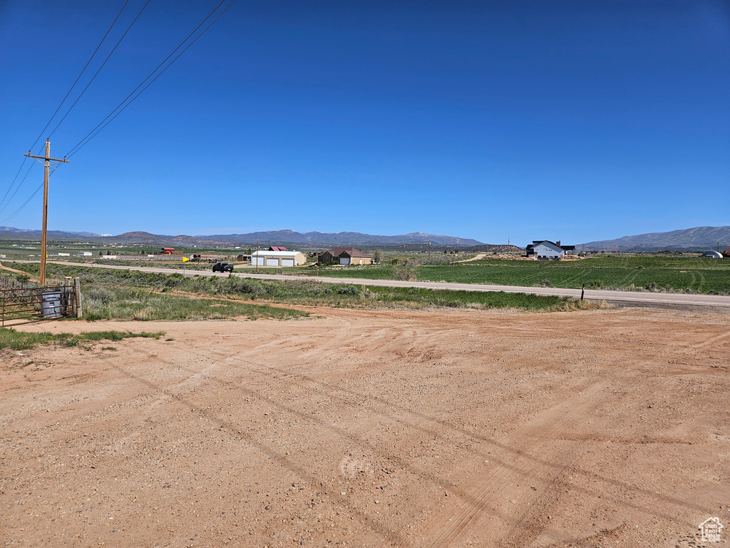 View of mountain backdrop featuring rural landscape