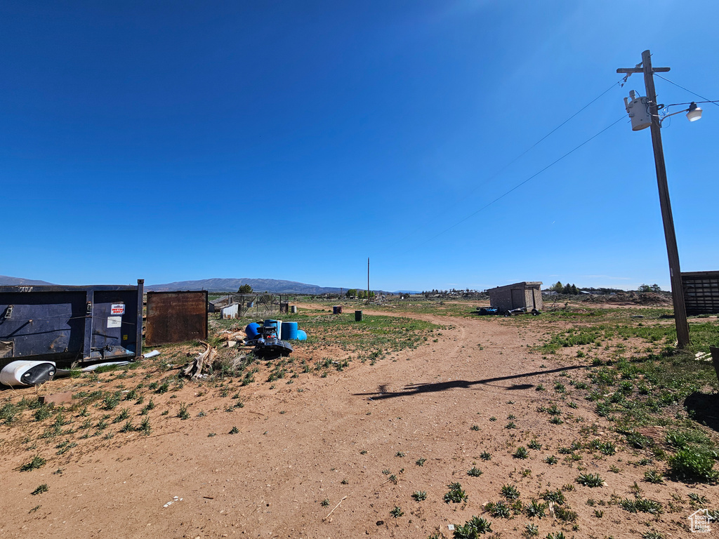 View of yard featuring a mountain view and a view of countryside