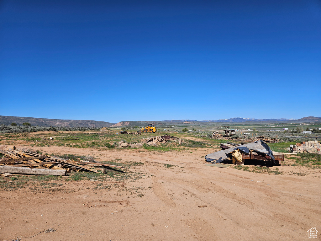 View of mountain backdrop featuring rural landscape