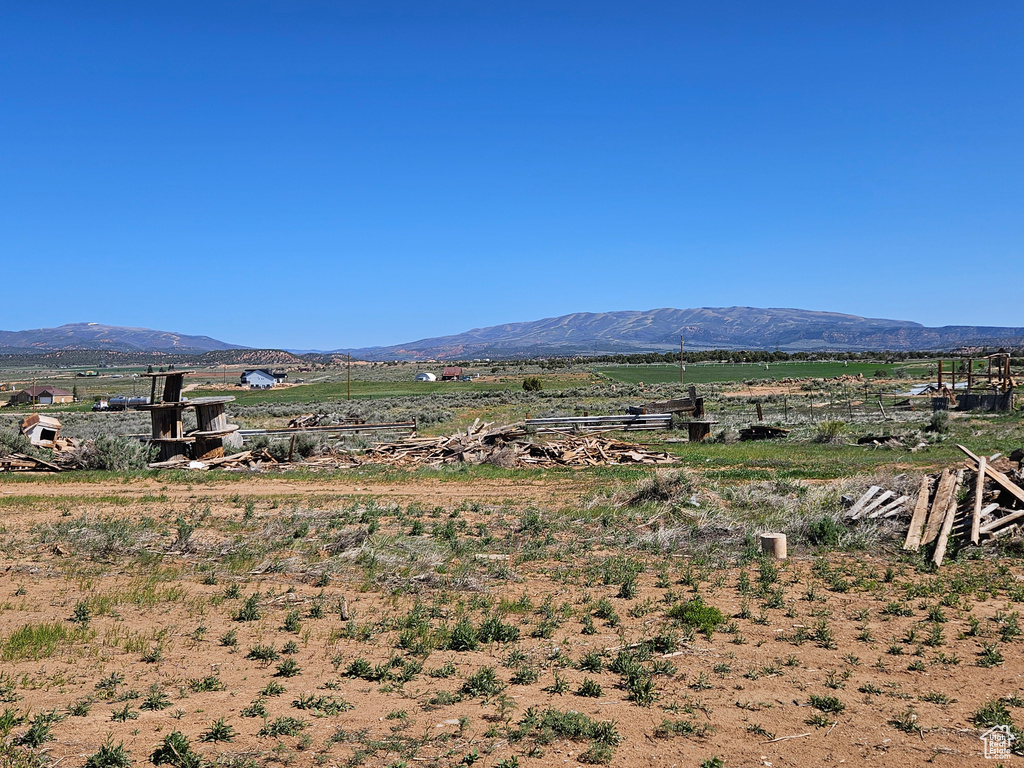 View of mountain backdrop with rural landscape