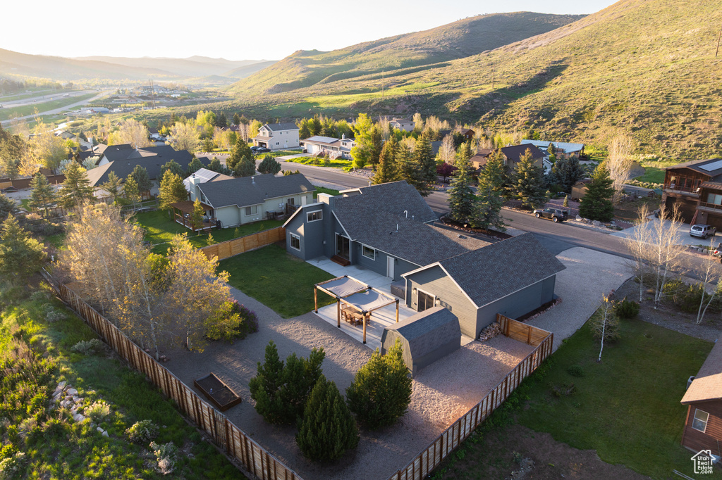 Aerial perspective of suburban area featuring a mountain backdrop