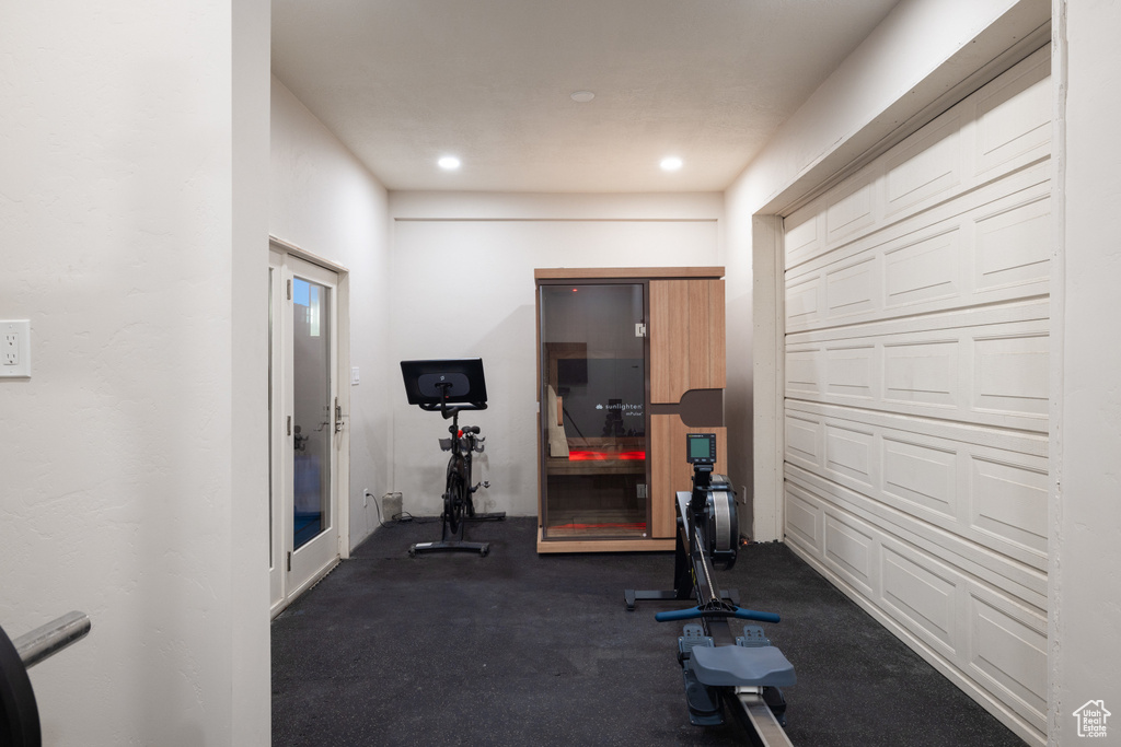 Exercise room featuring recessed lighting