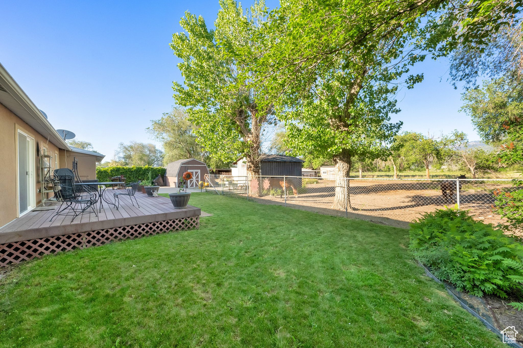 View of yard with a wooden deck