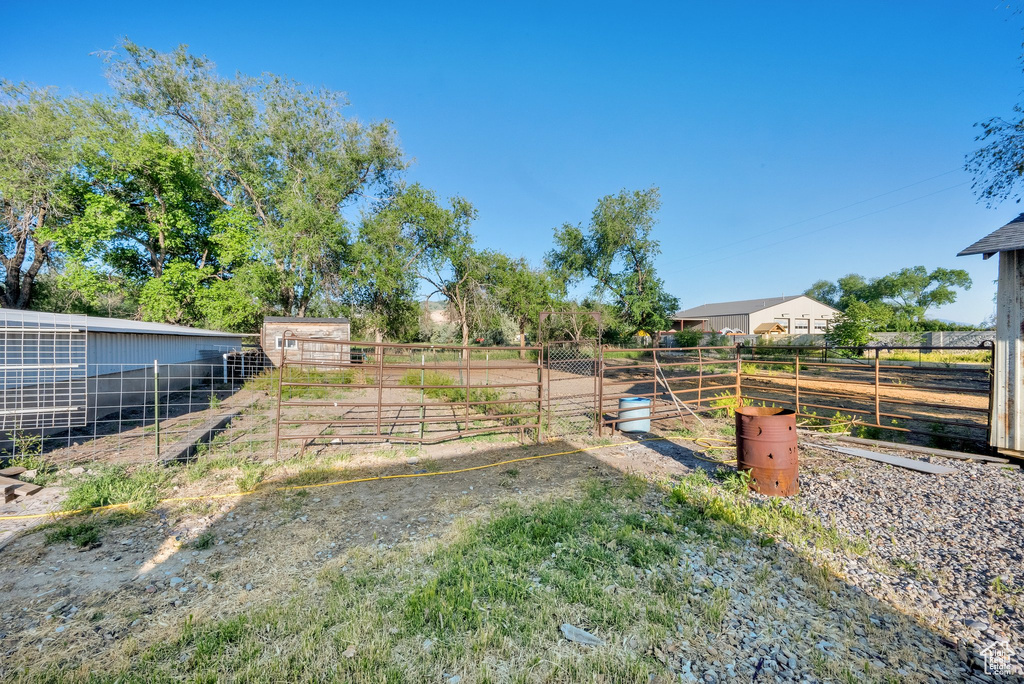 View of yard with an exterior structure and an outdoor structure