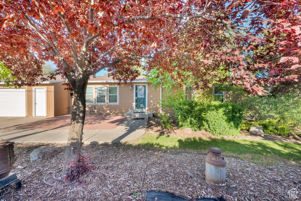 View of front of property featuring stucco siding and driveway