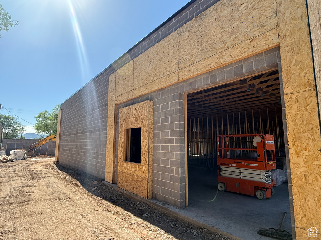 View of side of property featuring concrete block siding