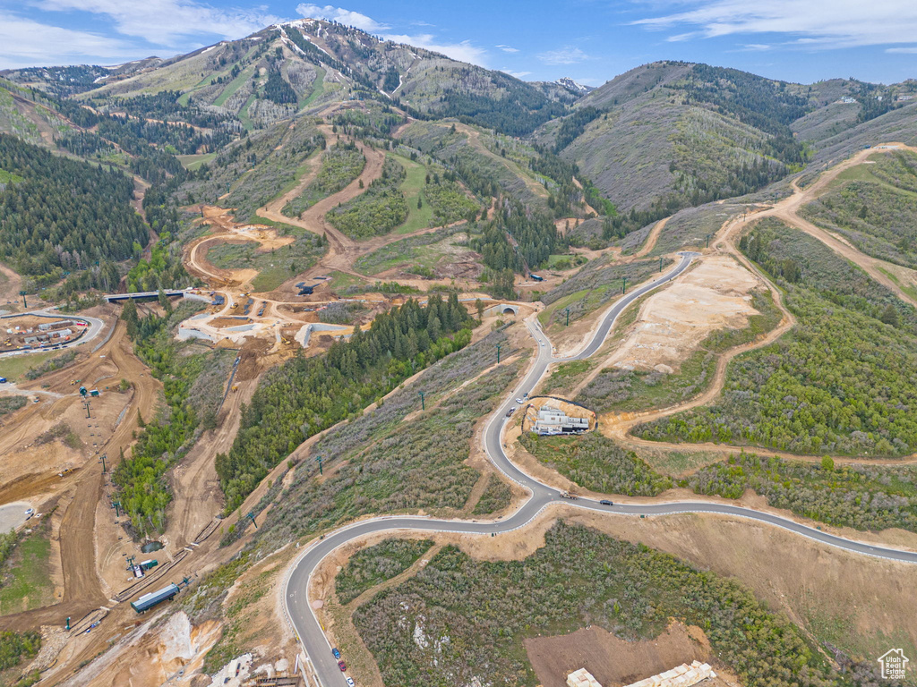 Aerial overview of property's location with a mountainous background