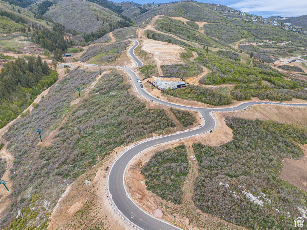 Aerial view of property's location with a mountain backdrop