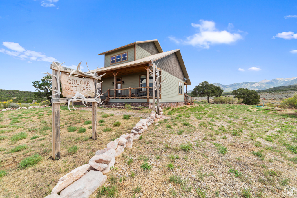 Back of house featuring a mountain view