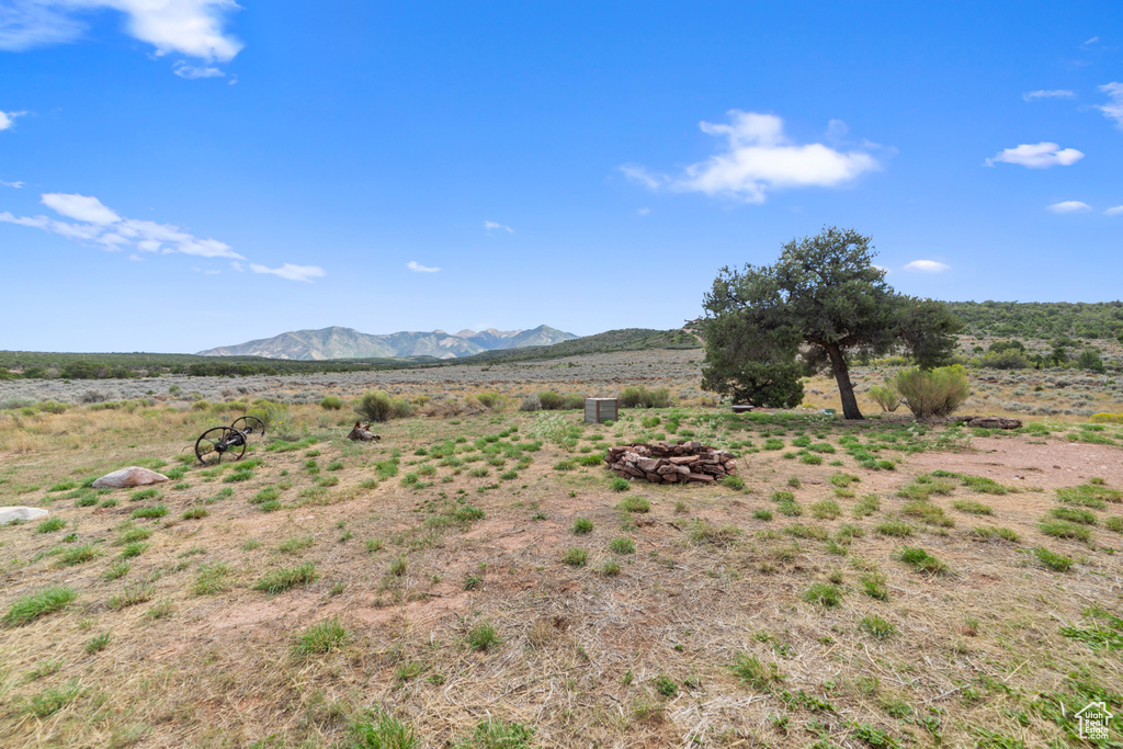 View of mountain background featuring rural landscape