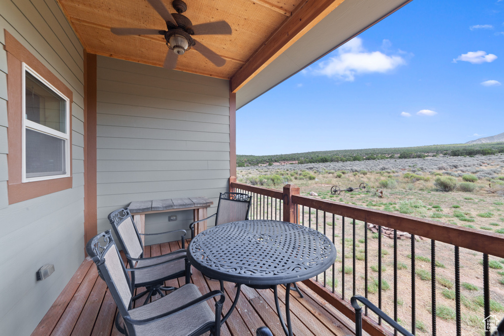 Balcony with a ceiling fan and a mountain view