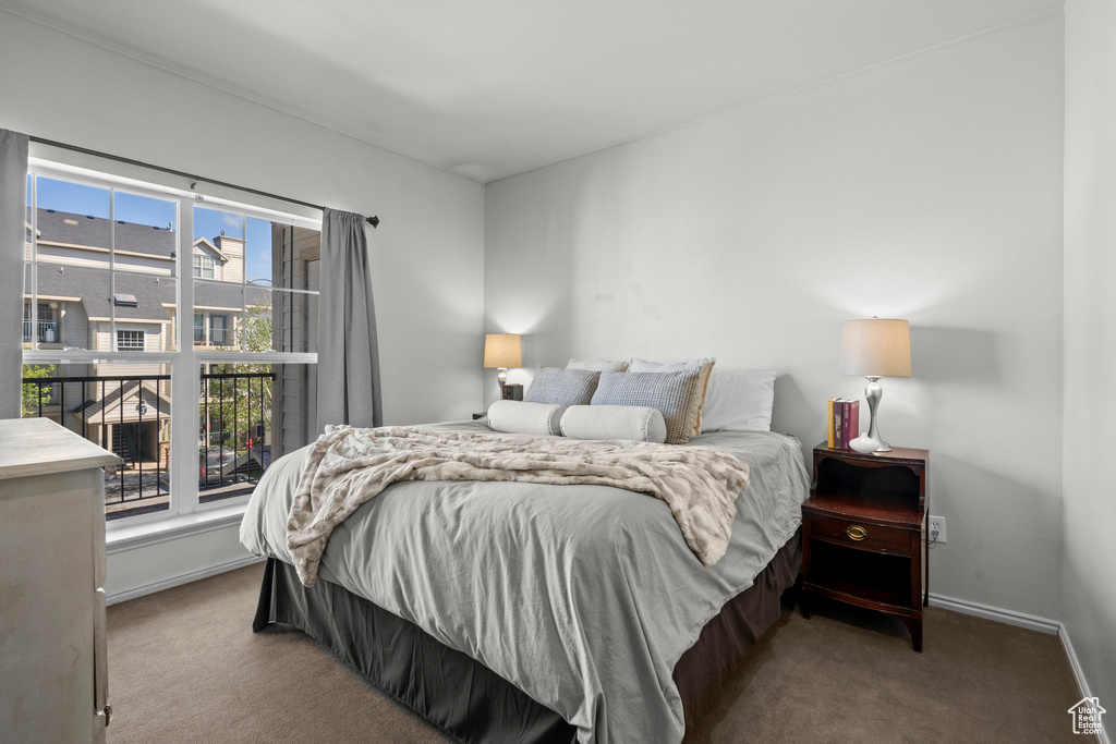 Bedroom with carpet floors and baseboards