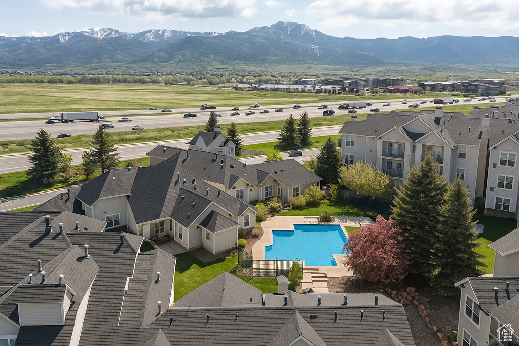Aerial view of a mountain backdrop and a pool
